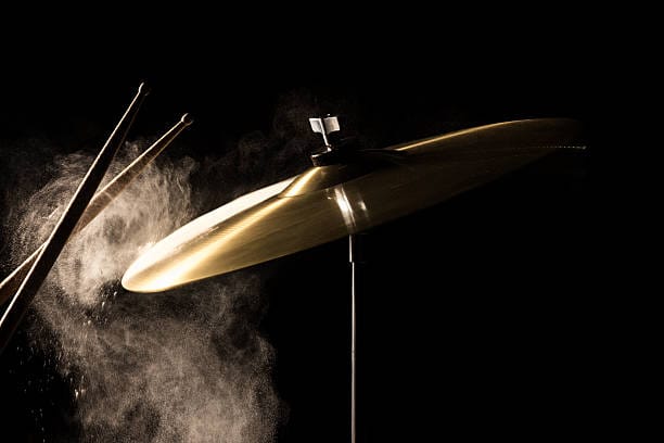 the drum stick hit on the crash in the low key backgroud